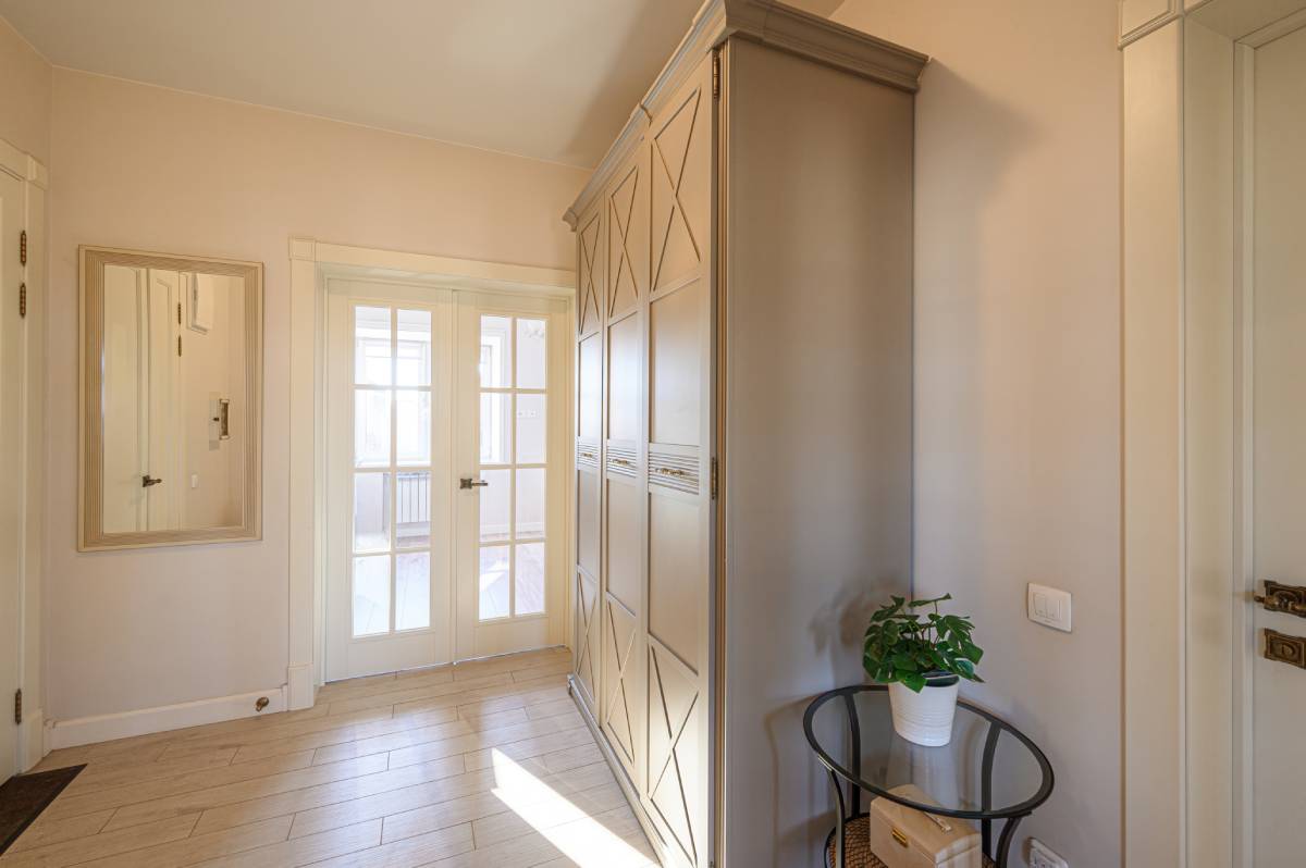  French doors inside a bright and airy home without window treatments, letting in unfiltered light at Signature Shutters & Blinds near Moraine, OH