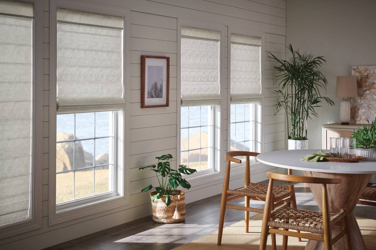 Graber® Roller Shades in a patterned fabric on large windows in a residential home
