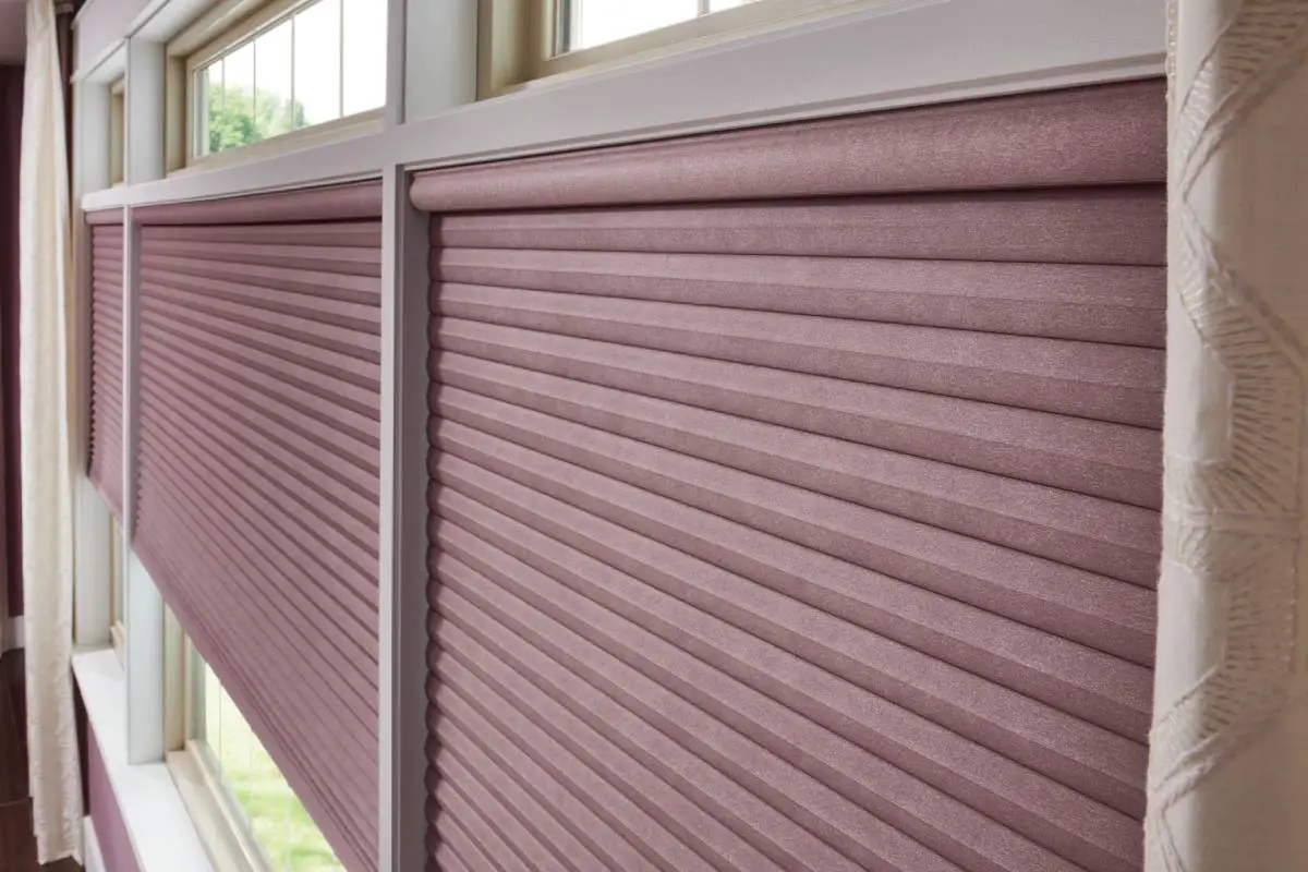 Graber Cellular Shades on Large Window in a residential living room paired with drapes