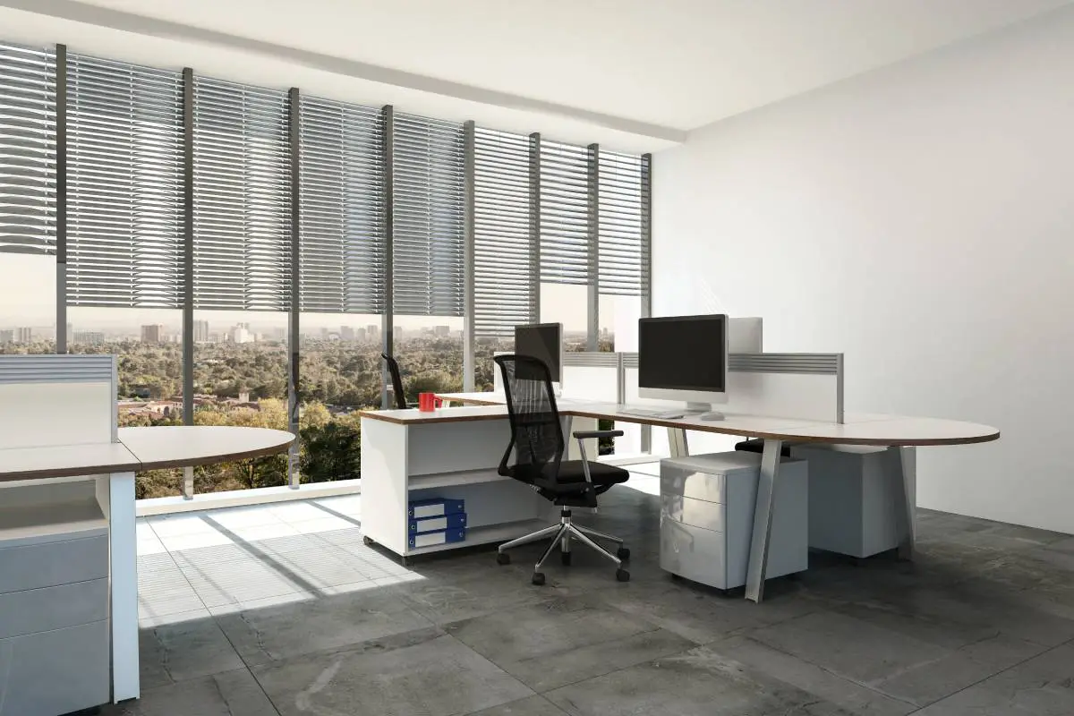 commercial-window-blinds-on-expansive-windows-in-a-shared-workspace-for-staff-members-1200px | Signature Shutters and Blinds Commercial window blinds on expansive windows in a shared workspace for staff members