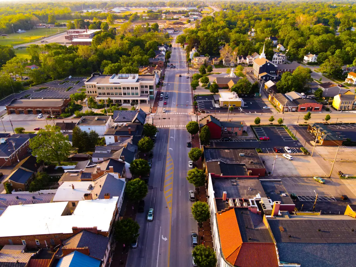 aerial-view-of-the-streets-and-business-buildings-and-more-in-lebanon-ohio-with-green-trees-1200px | Signature Shutters and Blinds Aerial view of the streets and business buildings and more in Lebanon, Ohio, with green trees